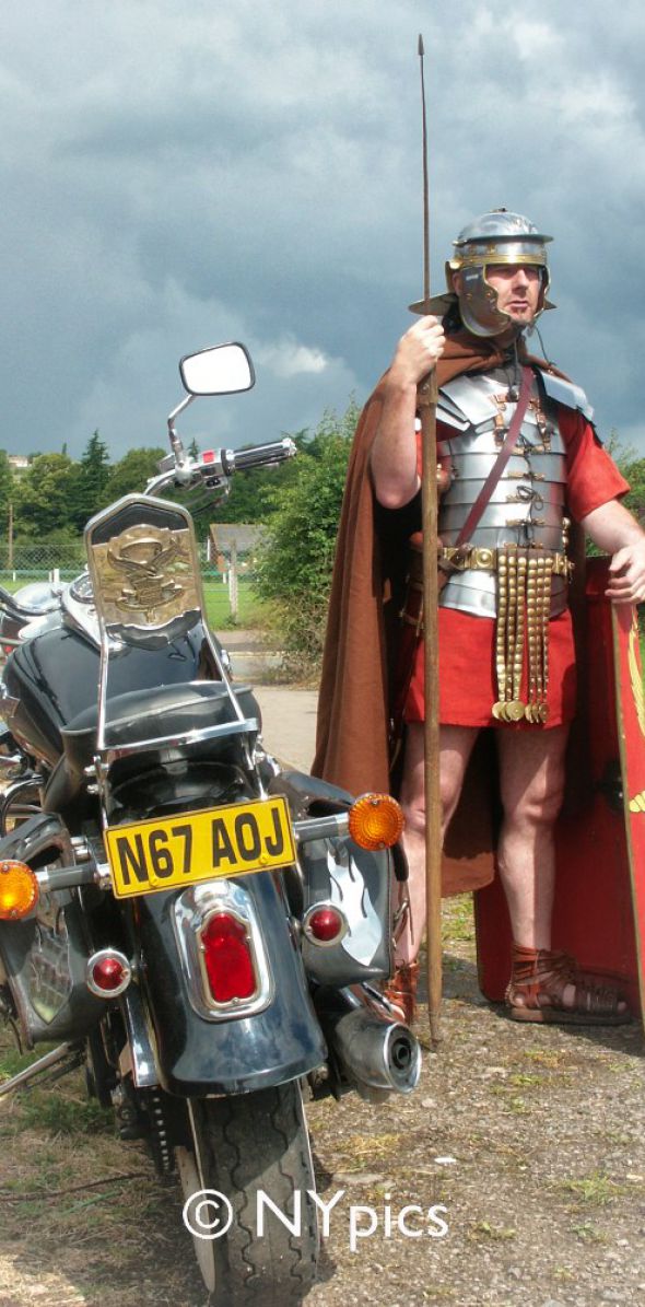 Roman Legionary Soldier Guarding A Motorbike